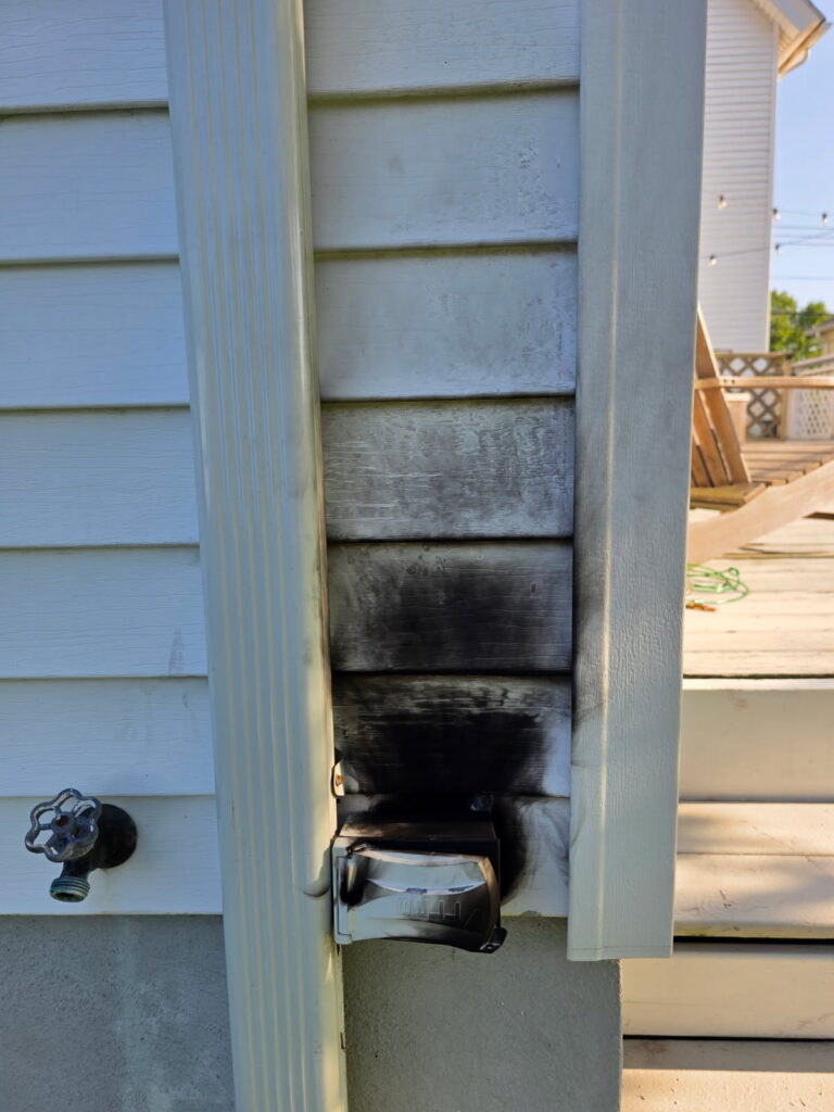 Burned outlet found on an older New Jersey home