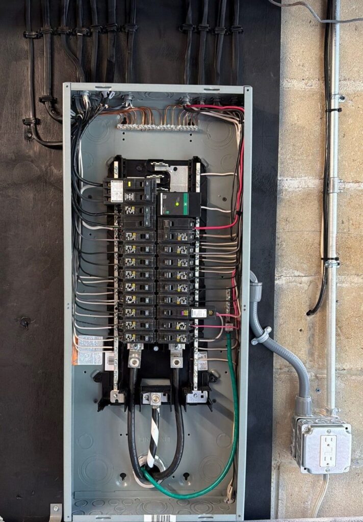 Electrical panel upgrade install full Square D panel with new breakers clean circuit wiring surge protector edited — Spartan Home Pros, Central New Jersey