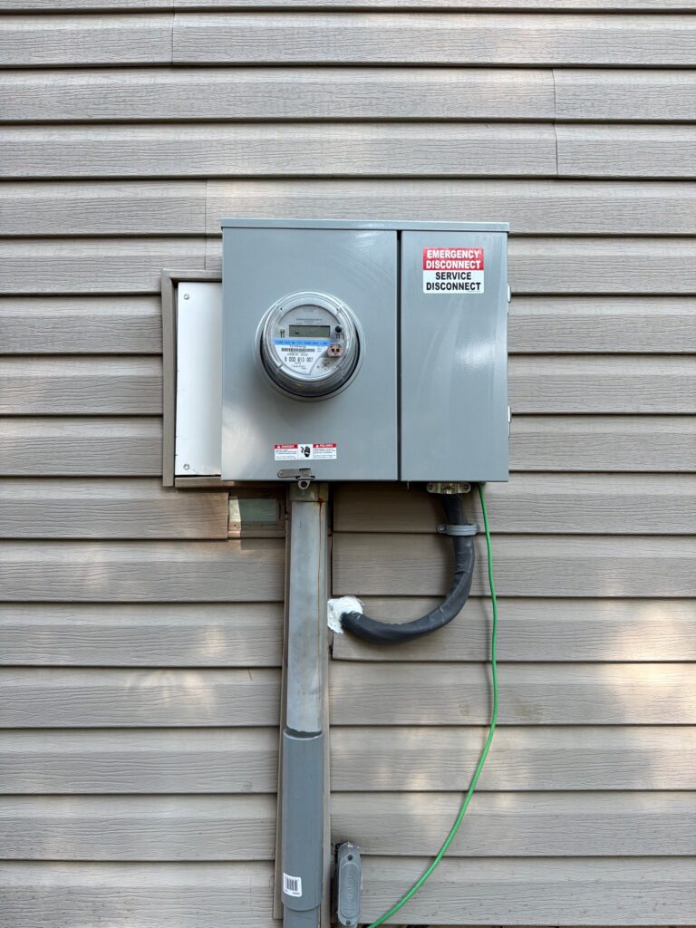 Outdoor electric meter with an emergency service shut-off installed on a home in Marlboro, NJ