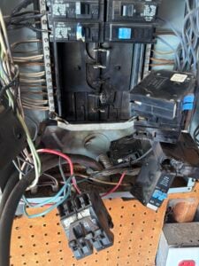 Burned electrical panel replaced by Spartan Home Pros after a homeowner smelled smoke