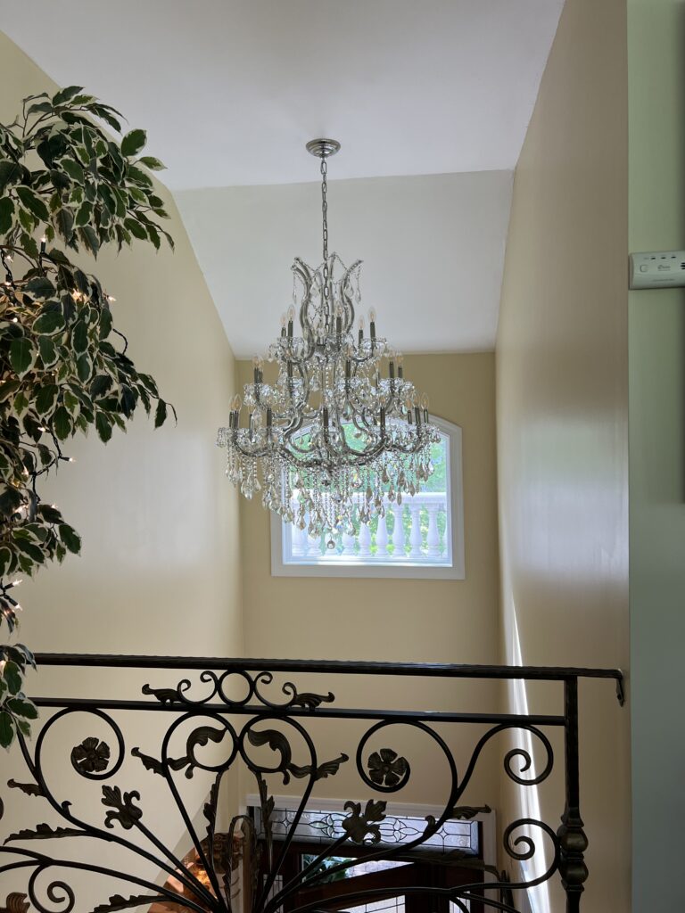 Multi Tier Crystal Chandelier Installation in Two Story Stairwell — Spartan Home Pros, Central New Jersey