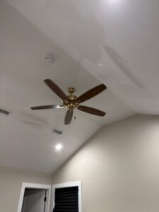 Vaulted ceiling with a brass ceiling fan installed — Spartan Home Pros, serving Warren, NJ