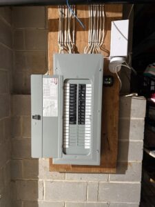 Electrical panel with whole-home surge protector installed — Spartan Home Pros, serving Montgomery and Belle Mead, NJ