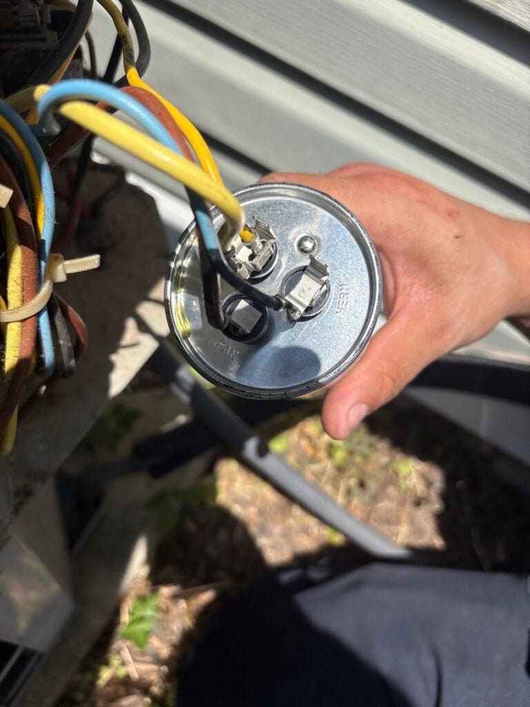 Dual run capacitor replaced on an air conditioner by Spartan Home Pros