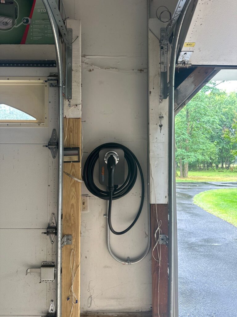 Level 2 EV charger installed in a home garage by Spartan Home Pros