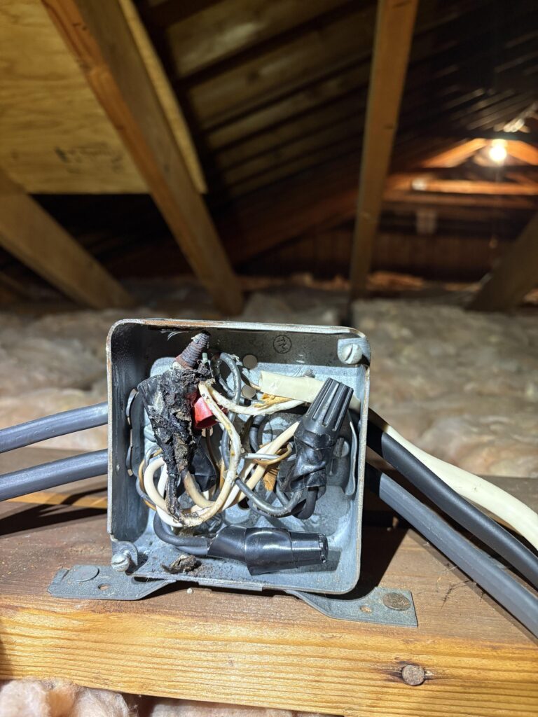 Burned aluminum wire connection found in the attic of an older New Jersey home