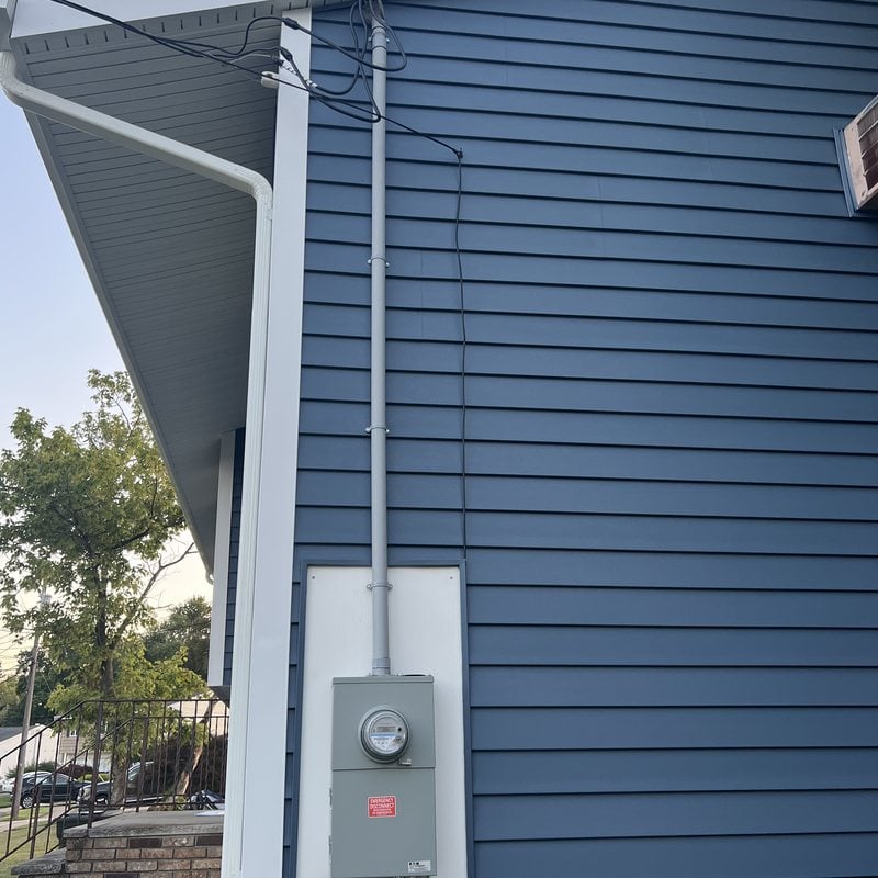 New outdoor meter and service riser installed by Spartan Home Pros on a New Jersey home