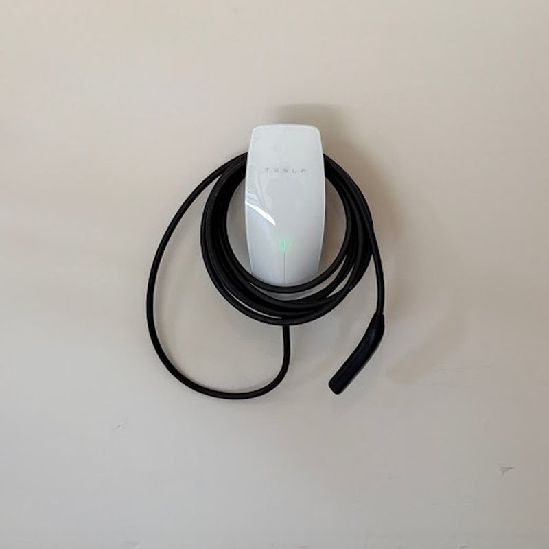 Tesla Wall Connector EV charger mounted in a New Jersey garage by Spartan Home Pros